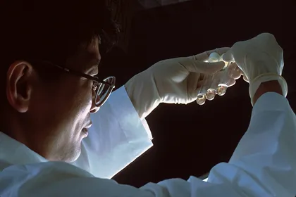 Scientist_man_glass tube in the air_facing right