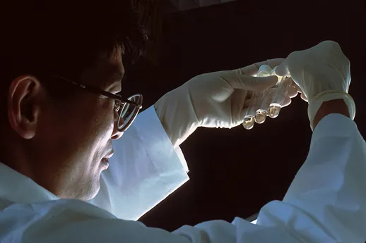 Scientist_man_glass tube in the air_facing right